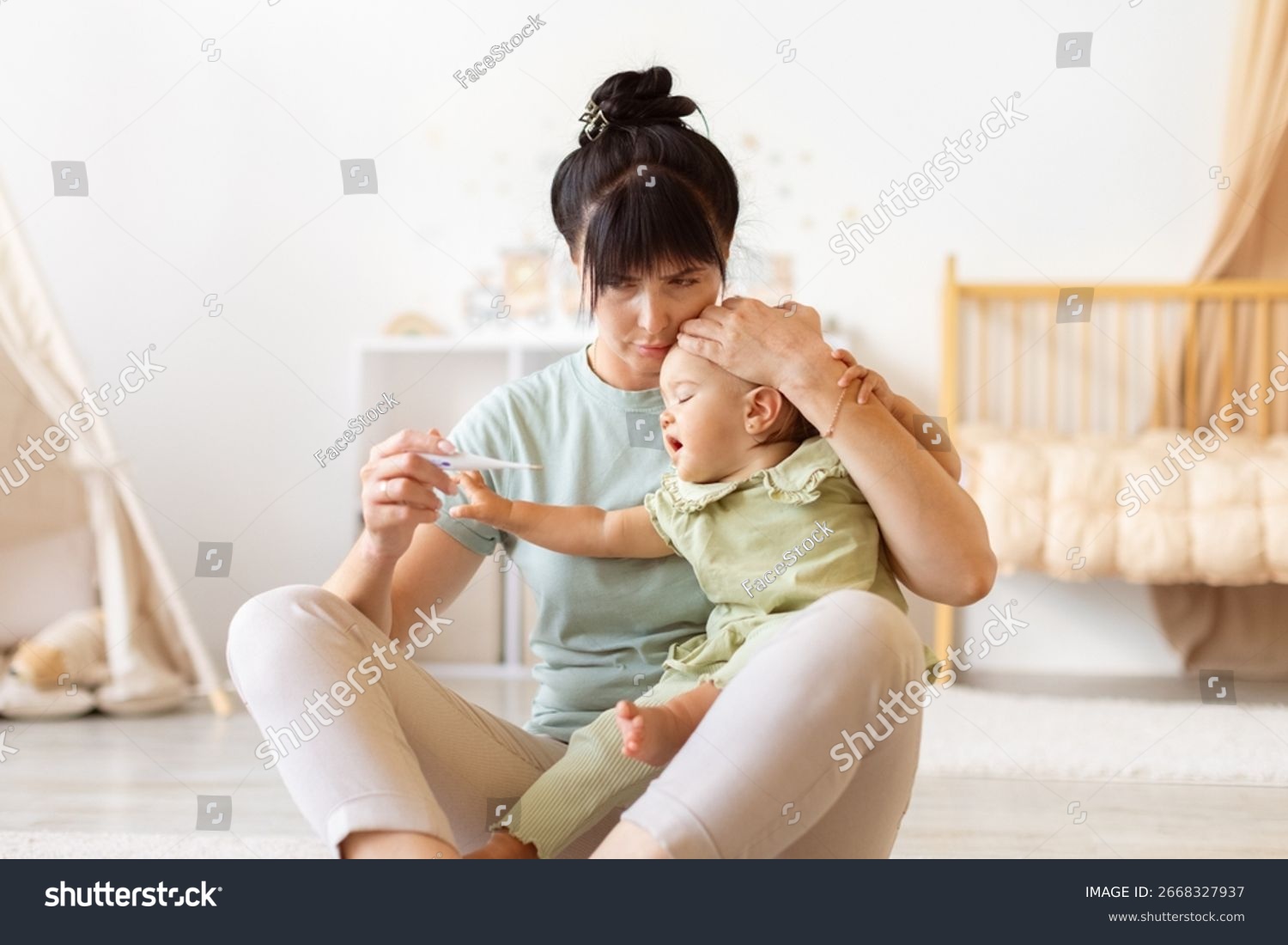 A concerned breastfeeding parent sitting on the edge of a bed holding a digital thermometer while a newborn rests nearby, realistic low light photography
