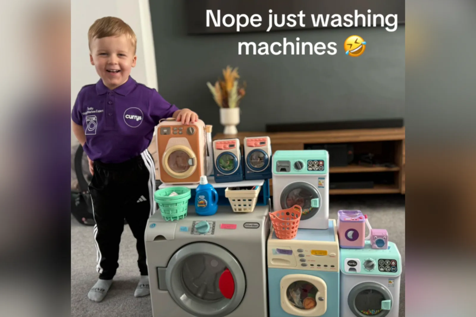 A parent helping a child place a plush stuffed animal into a front-loading washing machine in a bright laundry room, realistic family photo