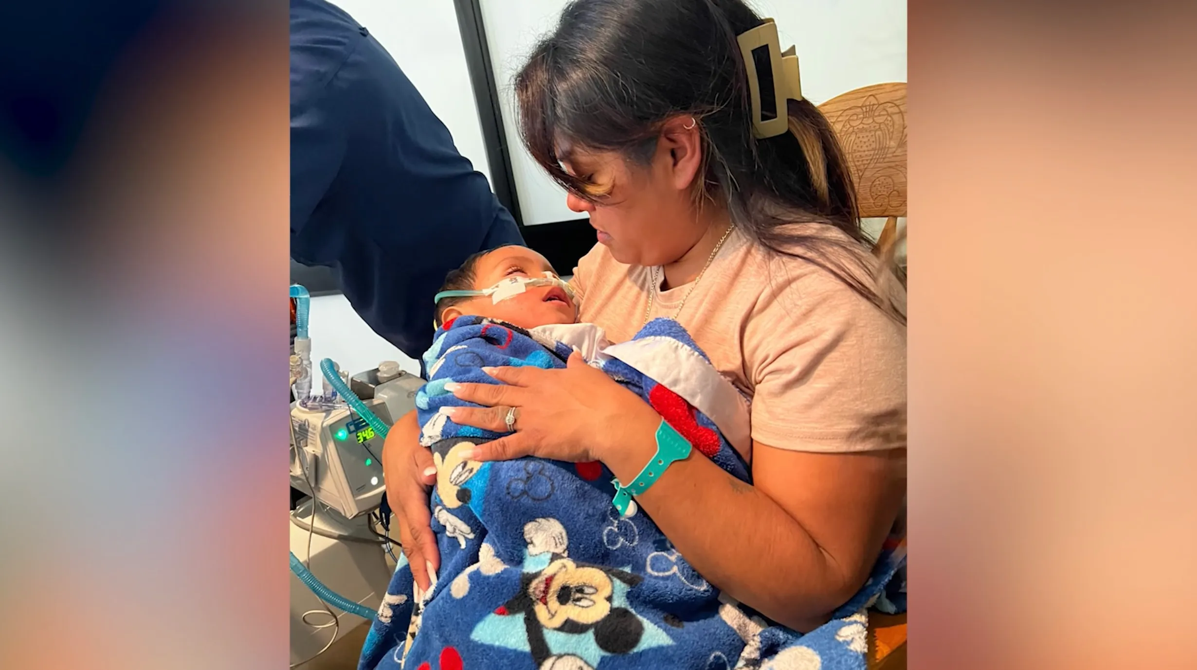 A parent kneeling beside a backyard swimming pool, holding a wet toddler wrapped in a towel while watching them closely, candid real-life photography style