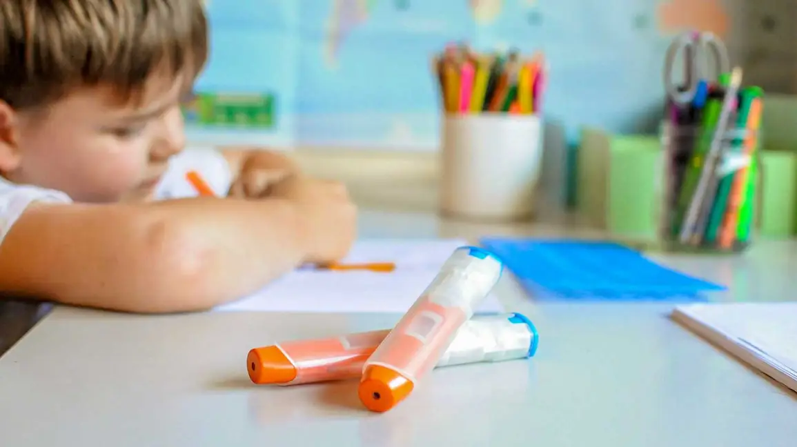 A parent kneeling on a living room rug giving an epinephrine auto-injector injection to a toddler’s outer thigh while another caregiver calls emergency services, realistic candid photo