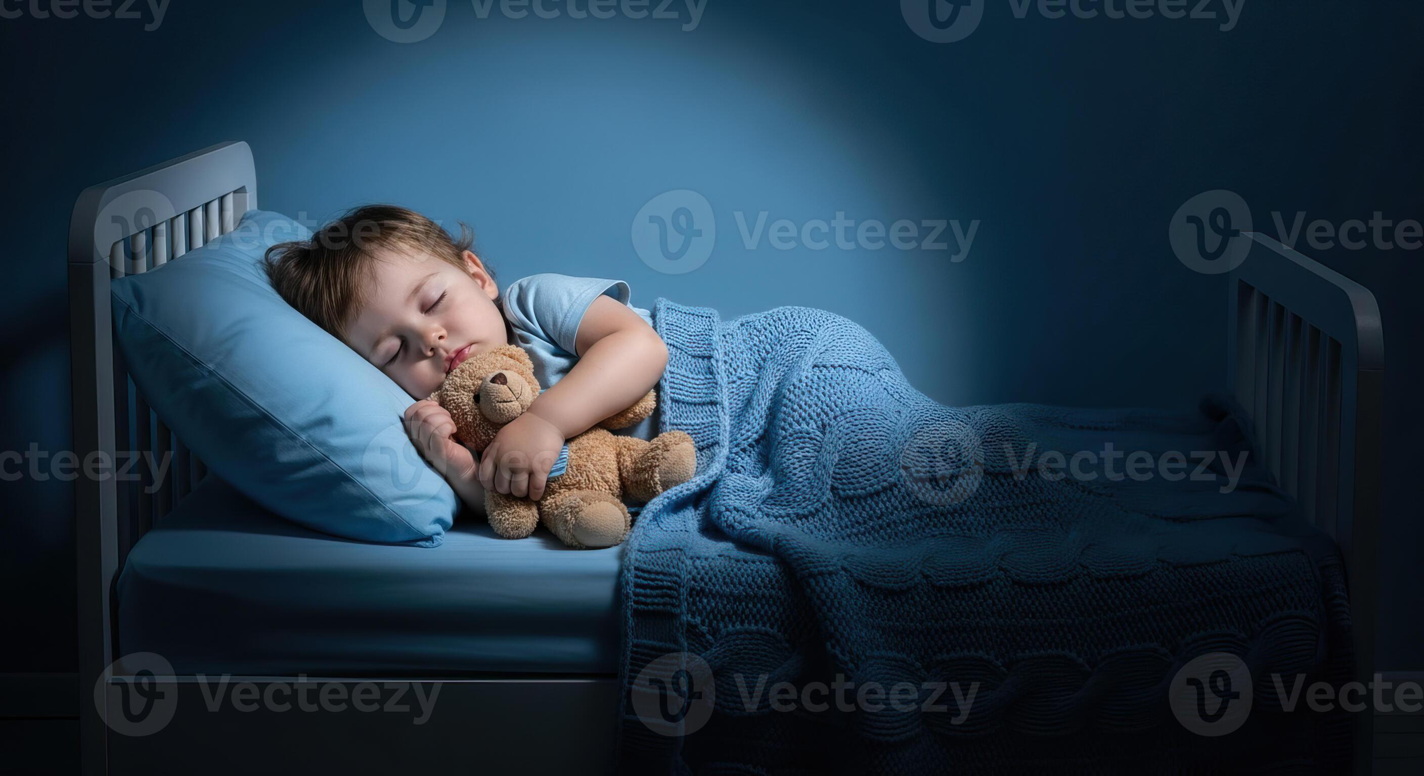 A toddler sleeping peacefully on their side in a low toddler bed with a dim nightlight in the room, calm bedtime photography style